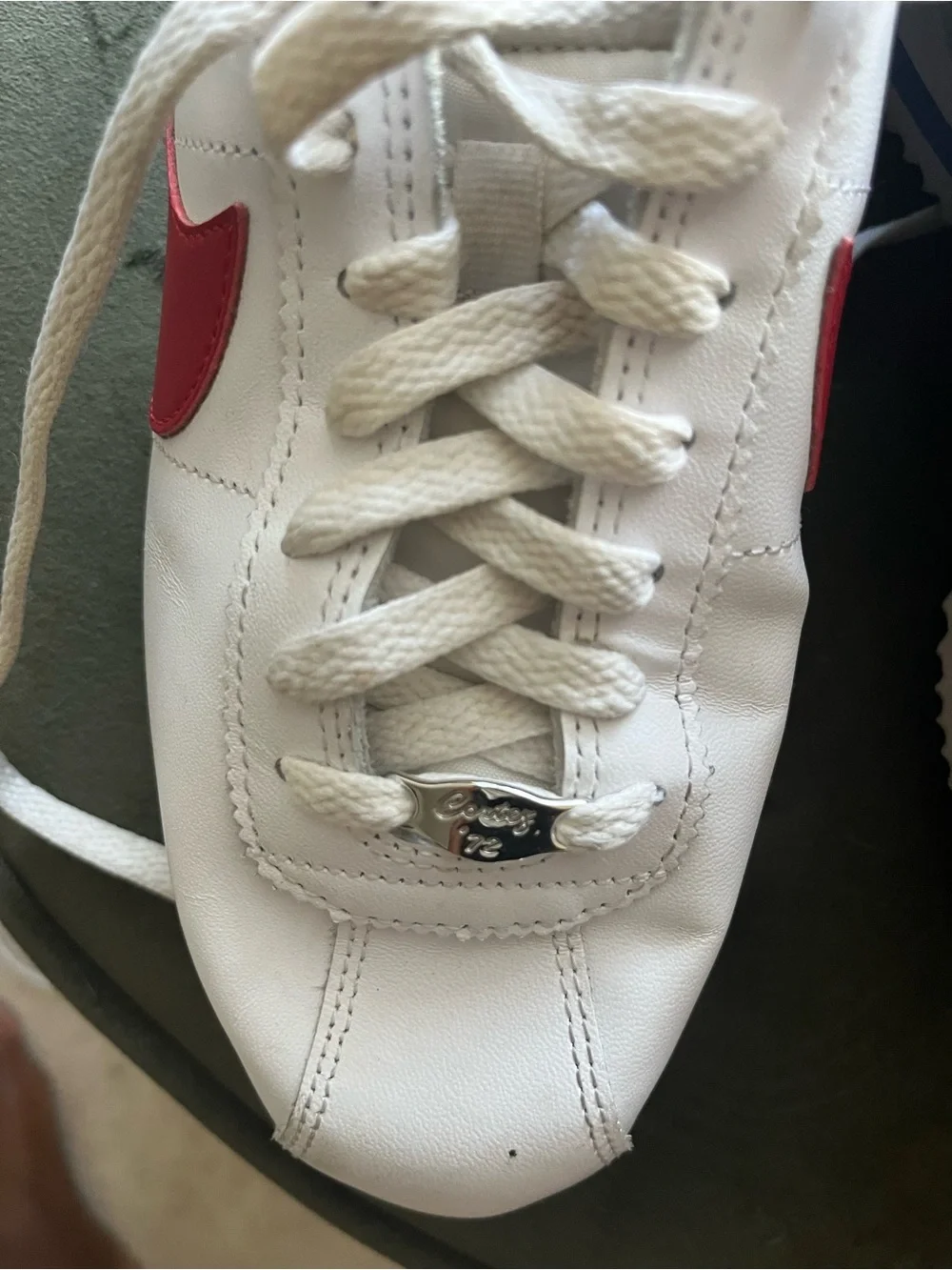 Nike Women's 8.5 White Leather Sneakers with Red Swoosh